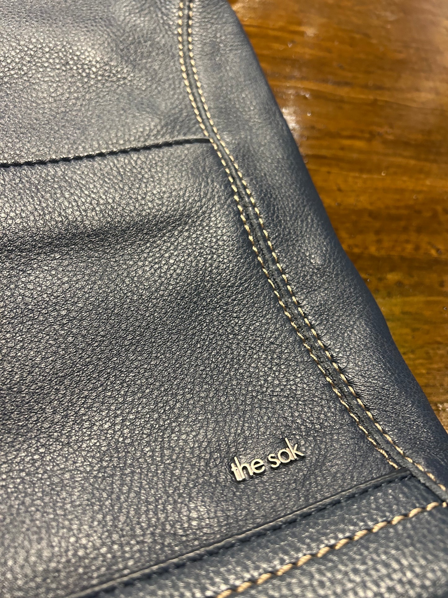 The Sak Dark Blue Shoulder Bag Adjustable Strap Zipper Pebbled Finish