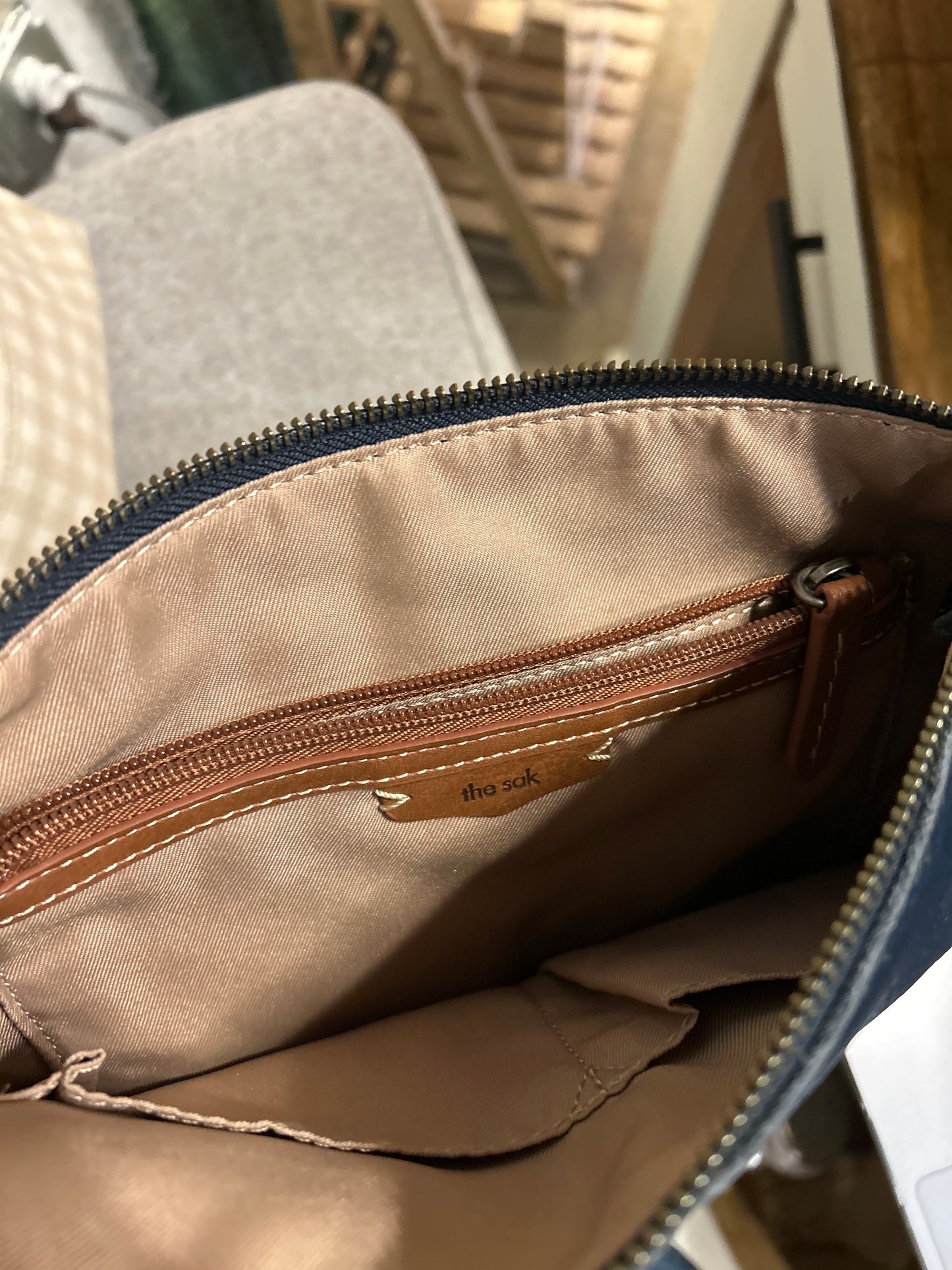 The Sak Dark Blue Shoulder Bag Adjustable Strap Zipper Pebbled Finish
